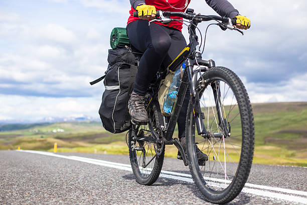 istock Biker rides on road at sunny summer day in Iceland 508668890