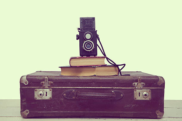istock Vintage suitcases with books and camera 508669308