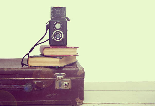 istock Vintage suitcases with books and camera 508669392