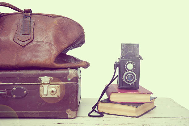 istock Vintage suitcases with books and camera 508669484