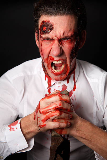 istock Psychopath with bloody knife 508669495