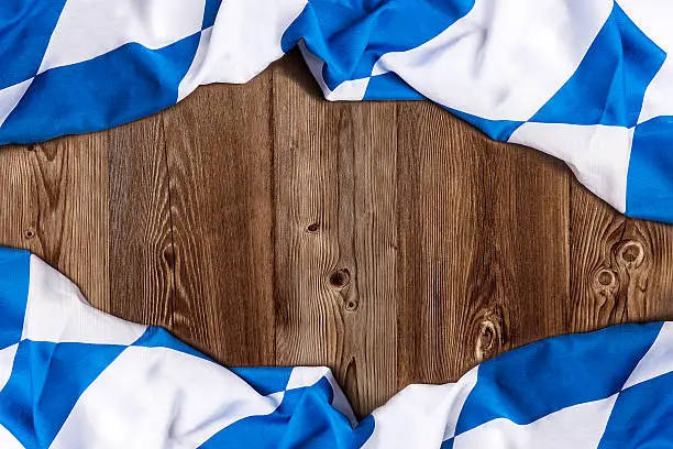 Bavarian flag on wooden board as a background for Beer Fest