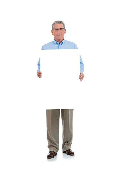 istock Senior man holding a large blank sign 508670649