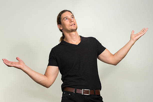 istock Man looking up with raised arms 508670764