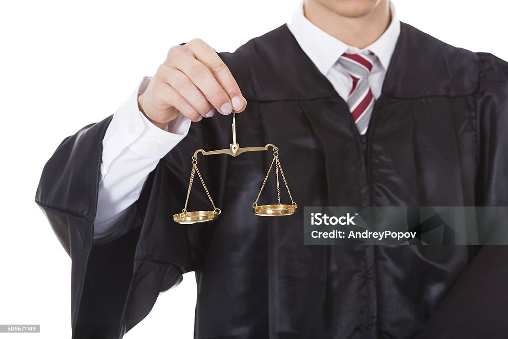 Judge With Scales And Book Young Male Judge Holding Golden Scales And Book Over White Background Weight Scale Stock Photo