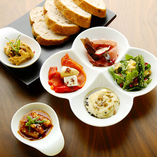 istock Mixed food on white and black plate 508671155