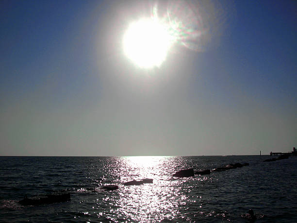 Sunset over summer sea with a small waves