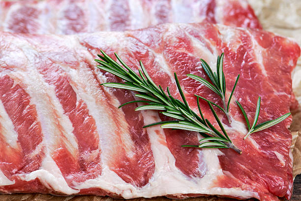 istock Raw Pork ribs with a rosemary. on crumpled paper 508671454