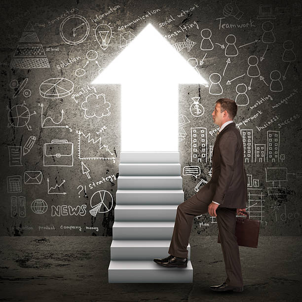 istock Businessman climbing up stairs 508671591