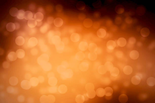 istock abstrack orange background with bokeh glitter lights and warm an 508671657