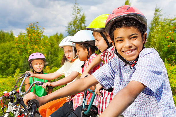 istock Smiling African guy in helmet with friends behind 508672865