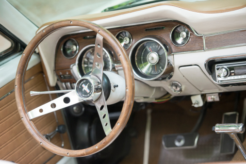 Bad Nauheim, Germany - August 17, 2014: Interior of a Ford Mustang 1968. The Ford Mustang has been one of the pioneers in the muscle car segment and has existed since 1964 and is currently (as of 2011) in its fifth generation. The mustang was continually popular throughout the 1970s for its agressive looks, capability, and reputation.