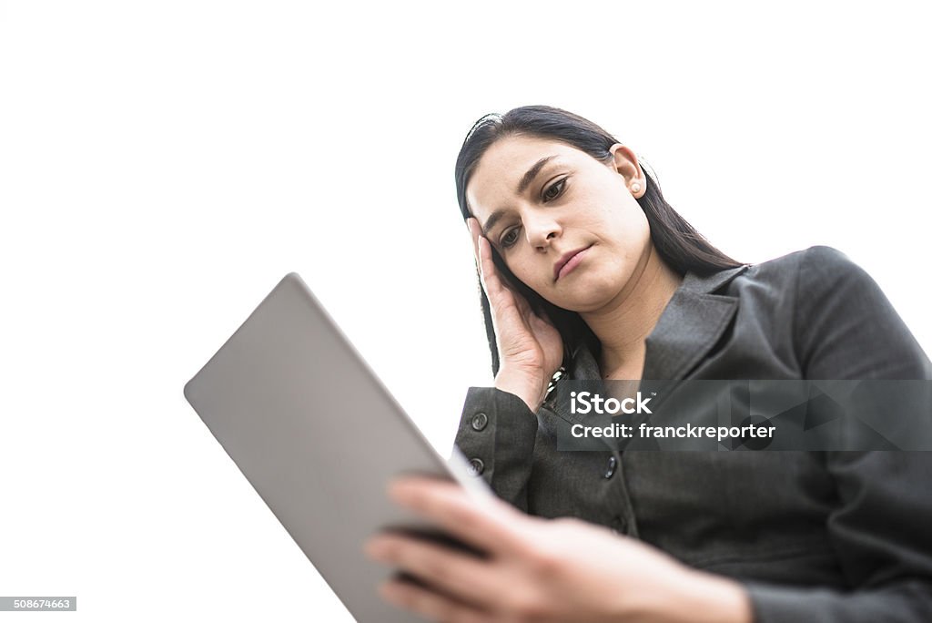 business woman worried surfing with tablet http://blogtoscano.altervista.org/bus.jpg   30-39 Years Stock Photo