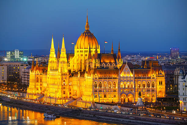 Parliament building in Budapest, Hungary Parliament building in Budapest, Hungary at sunset danube river stock pictures, royalty-free photos & images