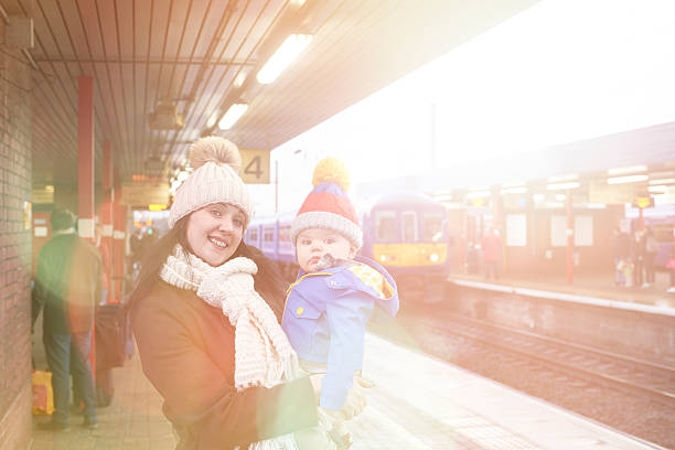 istock mother and child waiting on the train station platform 508699330