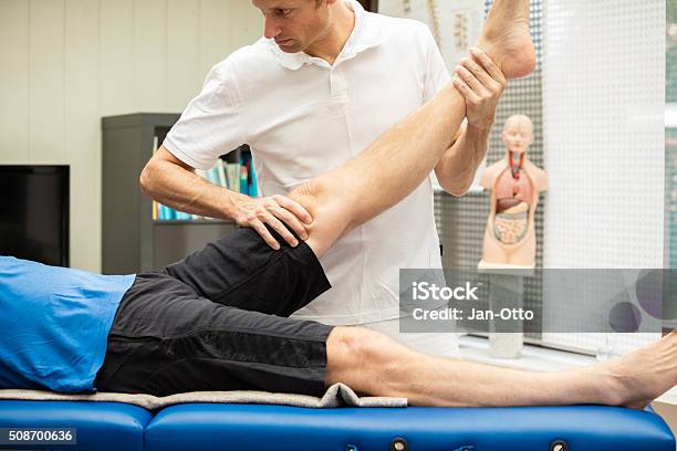 Doctor Performing Lasegue Test Stock Photo - Download Image Now - Human Spine, Doctor, Human Nervous System