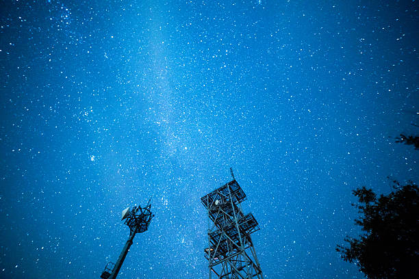 Milky Way above a silhouetted mountain scape. Okayama, Japan. February 2015Milky Way above silhouetted towers and trees. Okayama, Japan. February 2015