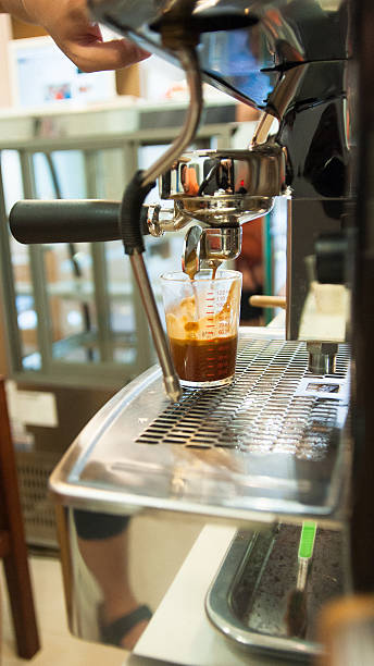 istock spresso machine pouring strong looking fresh coffee 508701874