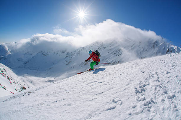 istock Skier skiing downhill in high mountains against sunset 508701955