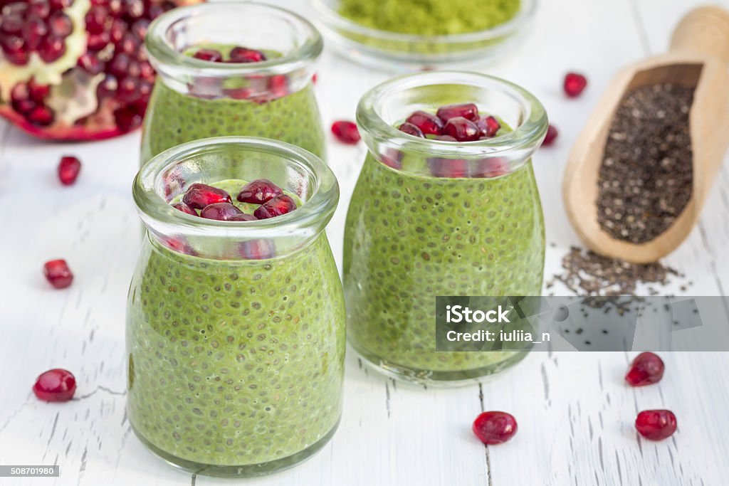 Chia seed pudding with matcha green tea, garnished with pomegranate Antioxidant Stock Photo