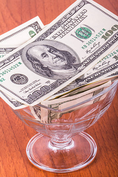 istock Dollar Banknotes in Glass Bowl 508702015