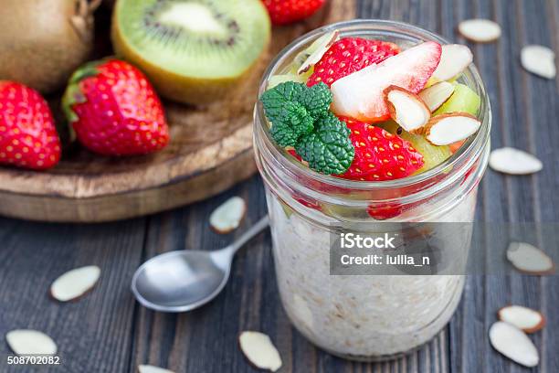 Overnight Oatmeal With Fresh Strawberry And Kiwi In Glass Jar Stock Photo - Download Image Now