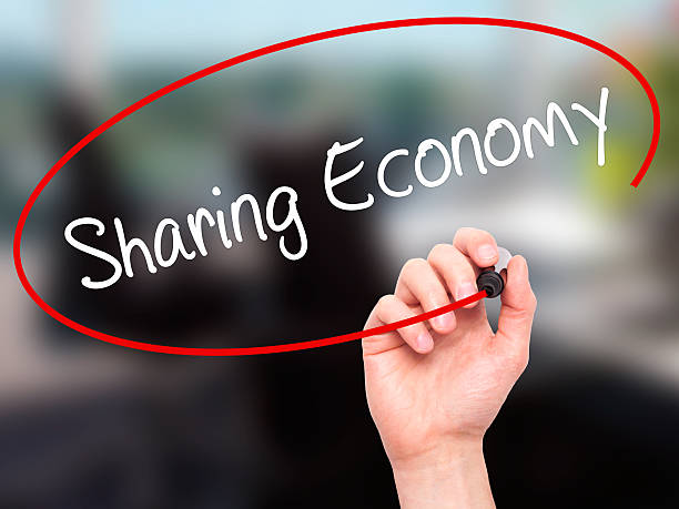 istock Man Hand writing Sharing Economy with black marker 508702160