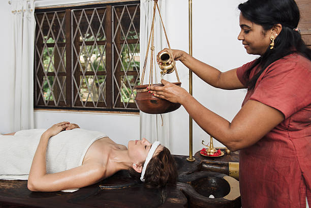 istock Ayurvedic shirodhara treatment in India 508704246