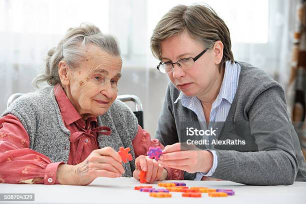 Senior Woman With Her Elder Care Nurse Stock Photo - Download Image Now - Dementia, Care, Senior Adult