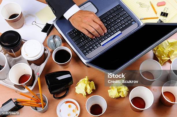 Cluttered Businessmans Desk Stock Photo - Download Image Now - Stained, Adult, Black Color