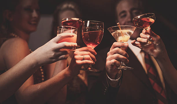 Celebration A man and four women are celebrating their success. happy hour stock pictures, royalty-free photos & images