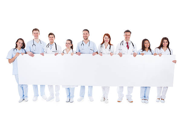 istock Large group of doctors and nurses with a banner 508705011
