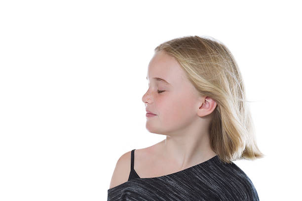 istock Young girl with her eyes closed 508705699