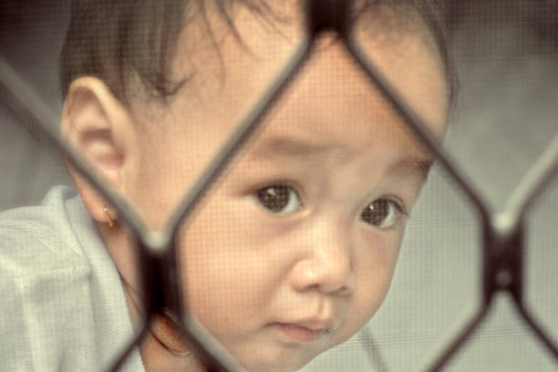 istock small child trap behind the door wire 508706300