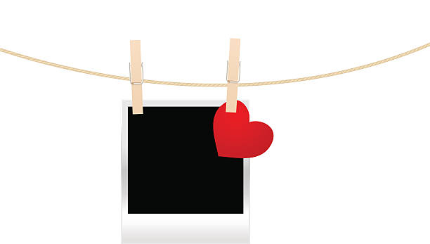 photo frame on the clothespin Vintage photo frame on the clothespin with hearts. Vector illustration. clothesline photos stock illustrations