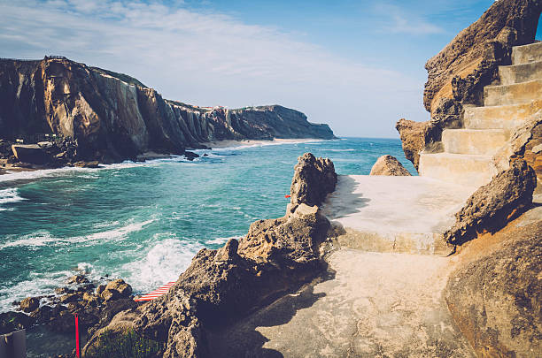 Yellow beach cliff in Santa Cruz, Portugal.