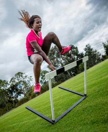 Woman steeple chasing - athletics concepts