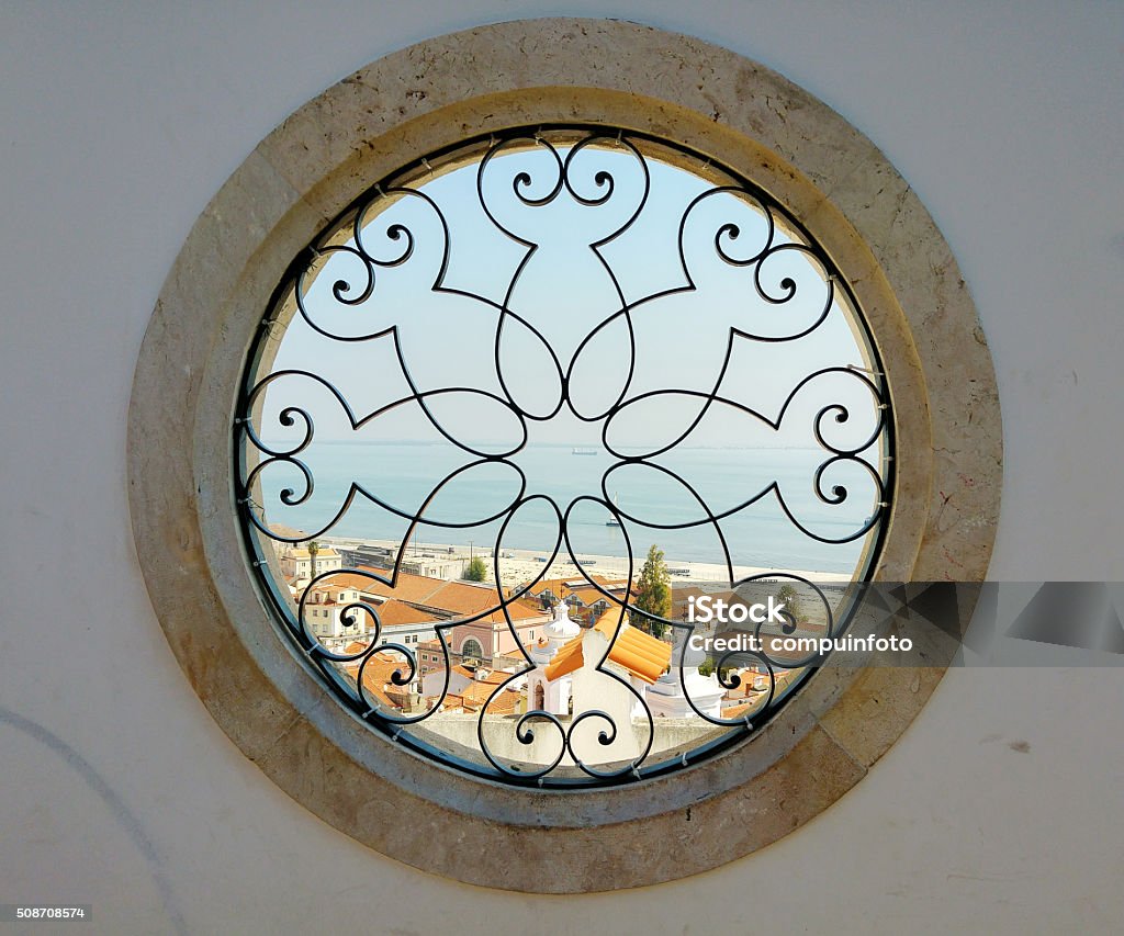 round windows with harbor view in lissabon round art window with view on the harbor and old city of lissabon in Portugal Circle Stock Photo