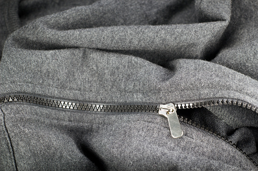 pastic zipper of gray jacket.