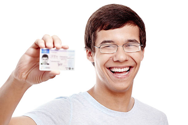 Rapaz com carta de condução - fotografia de stock