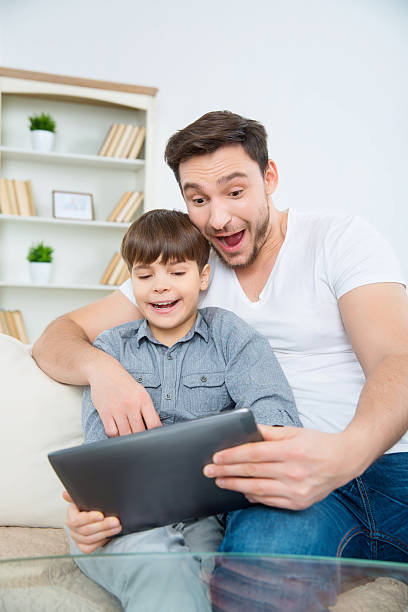 istock Astonished young man and his son at home 508711856