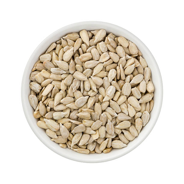 Sunflower Seeds in a Ceramic Bowl stock photo