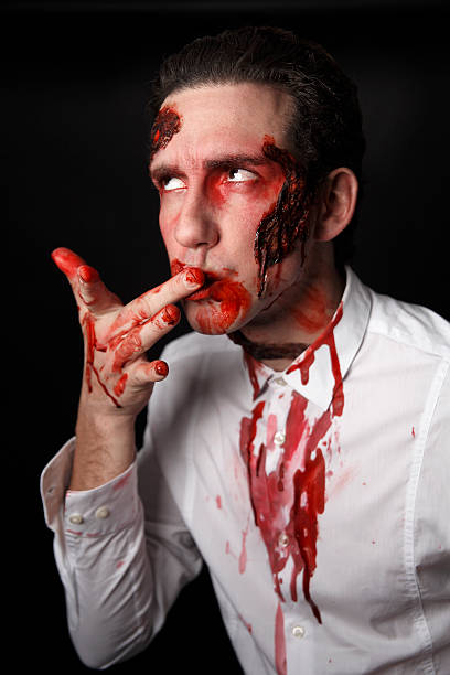 istock Psychopath with bloody fingers 508724575
