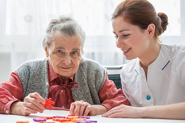 istock Senior woman with her elder care nurse 508726113