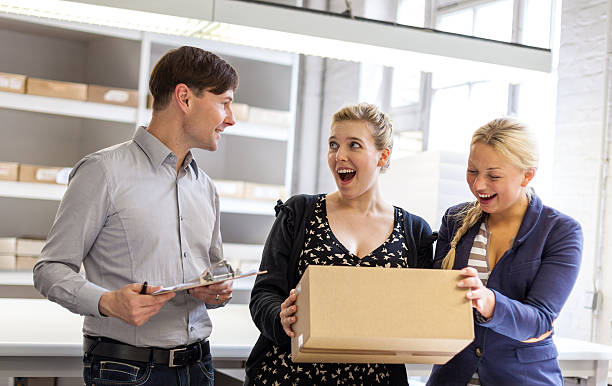 istock Young woman exited about parcel deliverd by postman 508728641