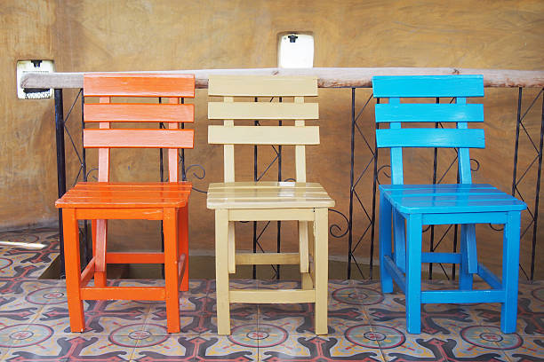 istock wooden chairs on ceramic tiles floor 508732373