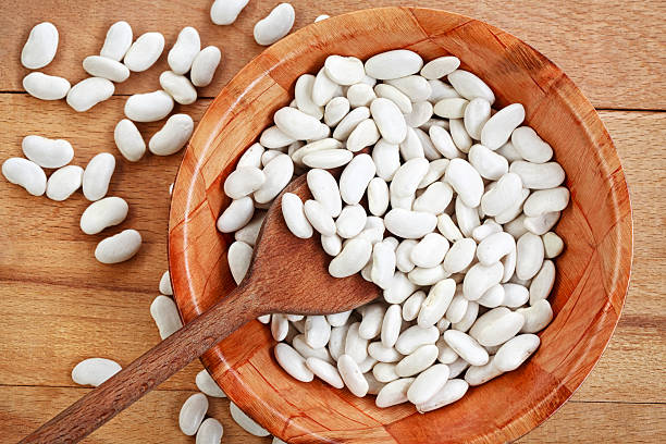 istock White beans on a wooden board 508746492