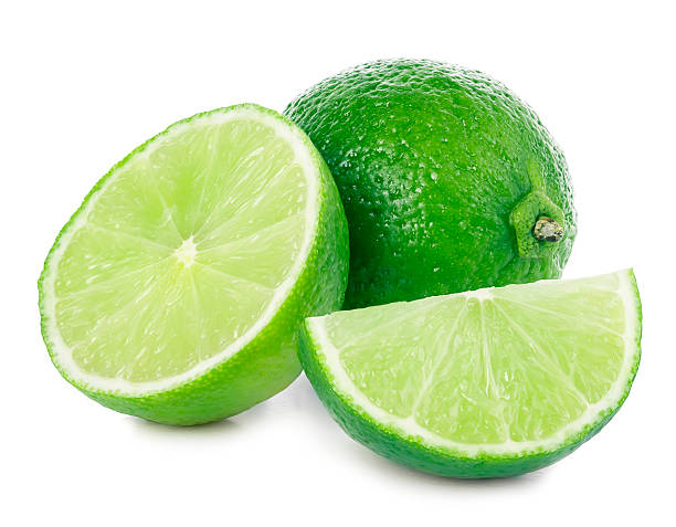 istock Lime. Whole lime with slices isolated on white background, 508747582