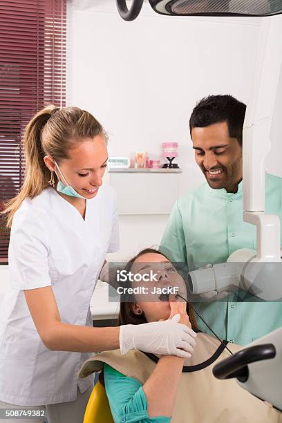 Dentist Examines Patient At Clinic Stock Photo - Download Image Now - 20-29 Years, 25-29 Years, Adult