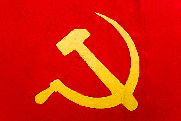 sickle and hammer on a red wall